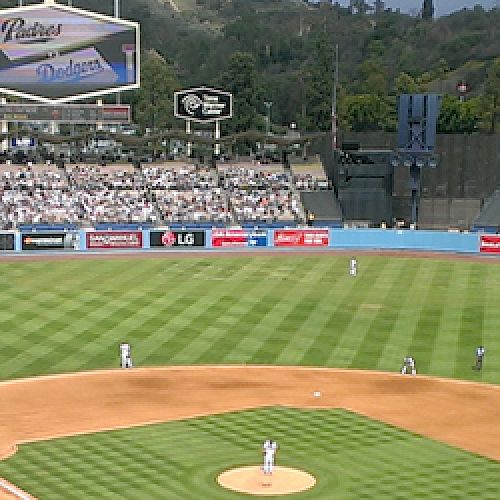 A panoramic view of a baseball stadium packed with fans during a game.
