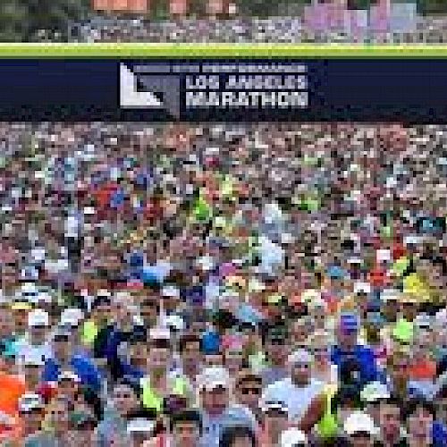 A large crowd of runners at the start line of the Los Angeles Marathon.